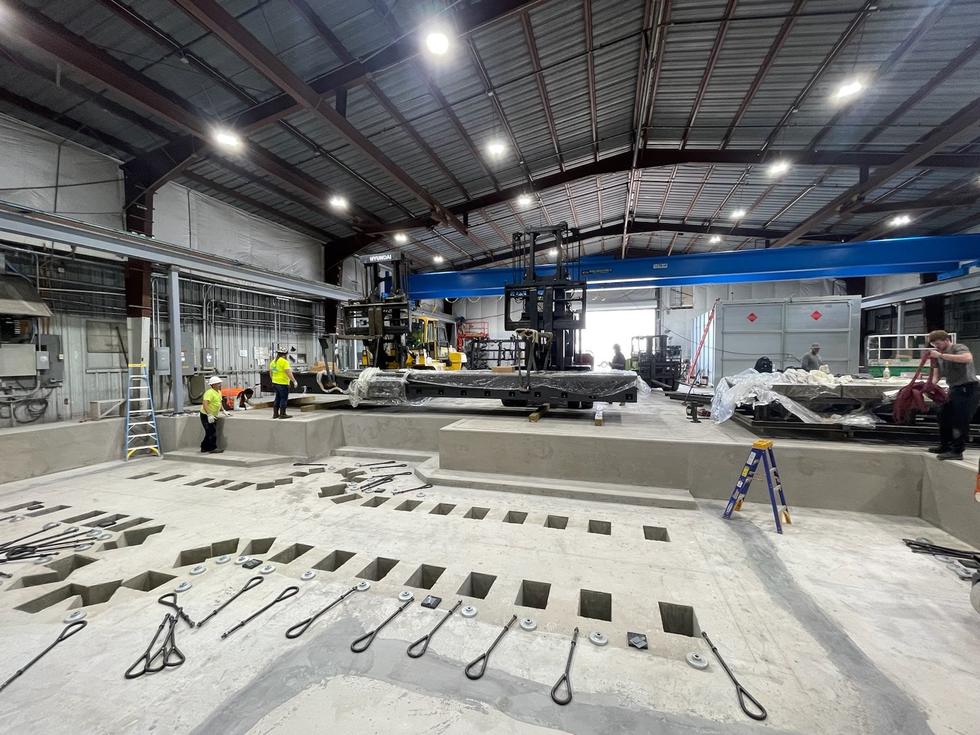 Slab modifications and bridge crane additions inside an existing metal building, Crestview, Florida